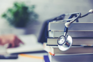 Stethoscope on a stack of books